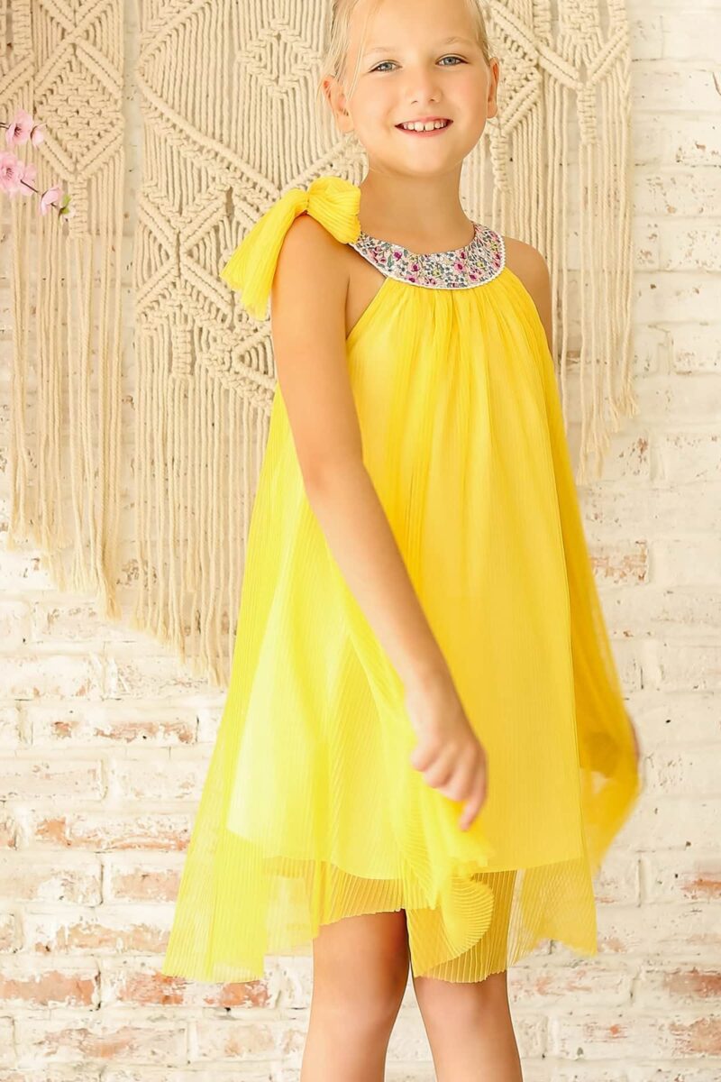 Yellow formal dress with pink and blue floral collar for little girls n from the children's fashion brand LA FAUTE A VOLTAIRE