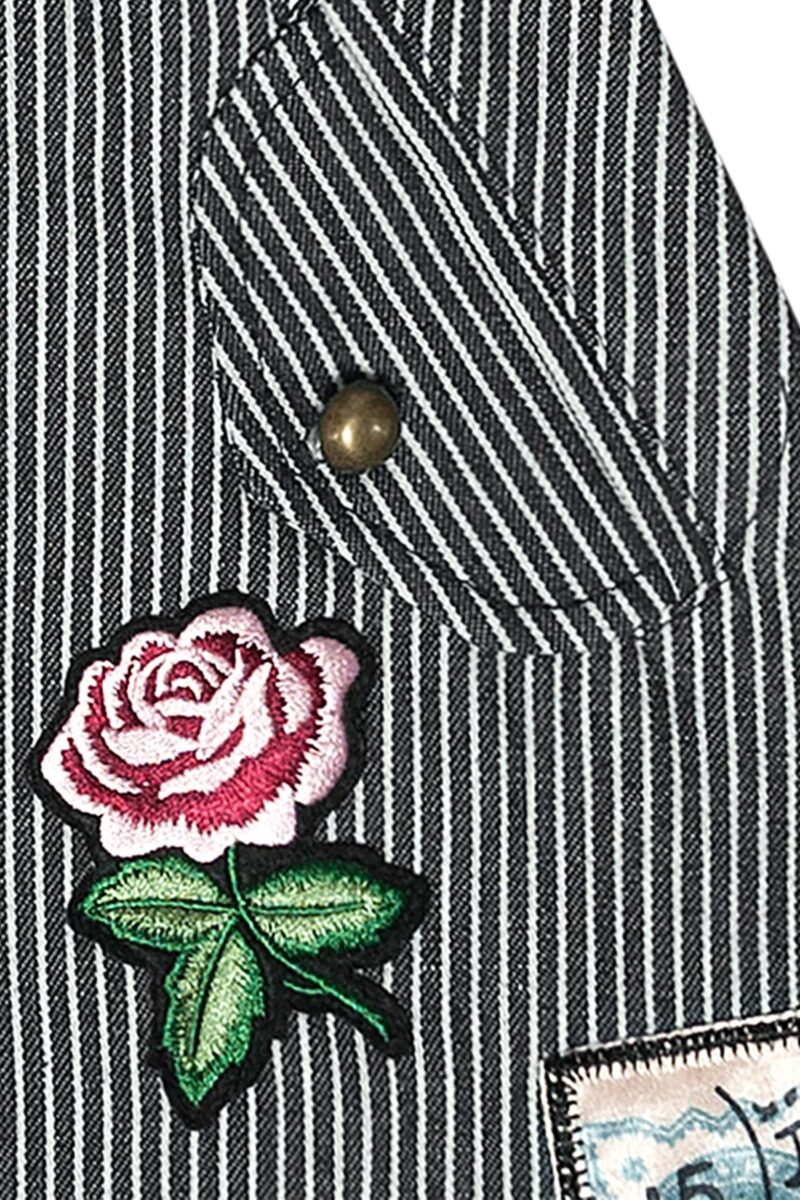 Short denim skirt for girl in blue and beige stripes with pink flower patch from the children's fashion brand LA FAUTE A VOLTAIRE