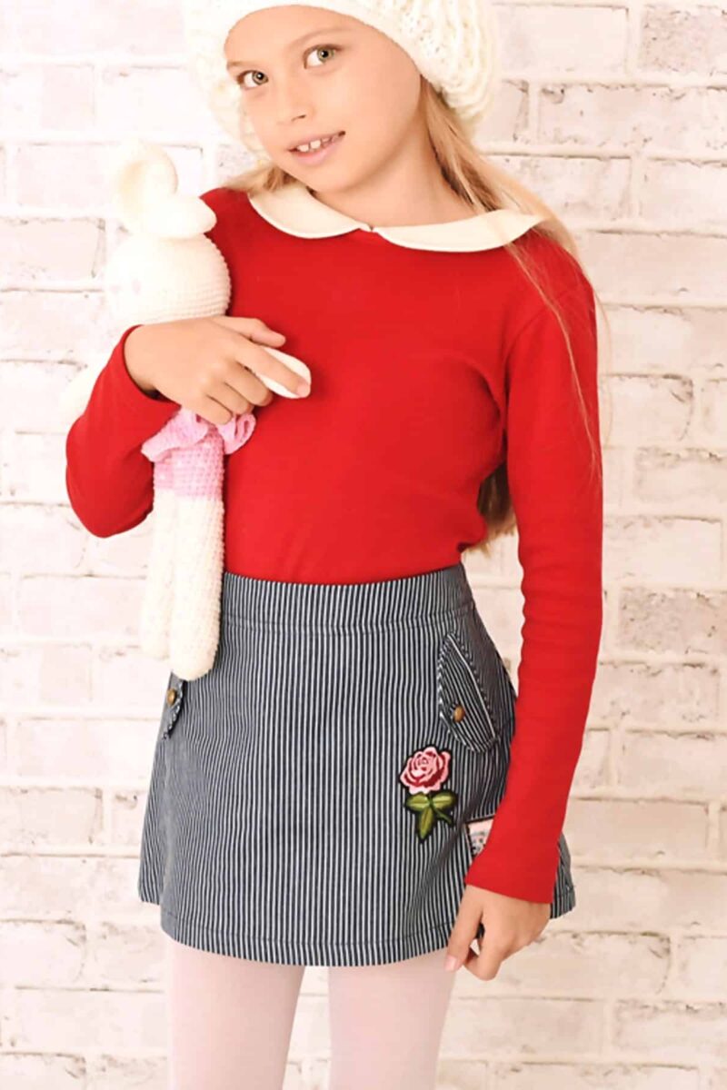 Short denim skirt for girl in blue and beige stripes with pink flower patch from the children's fashion brand LA FAUTE A VOLTAIRE